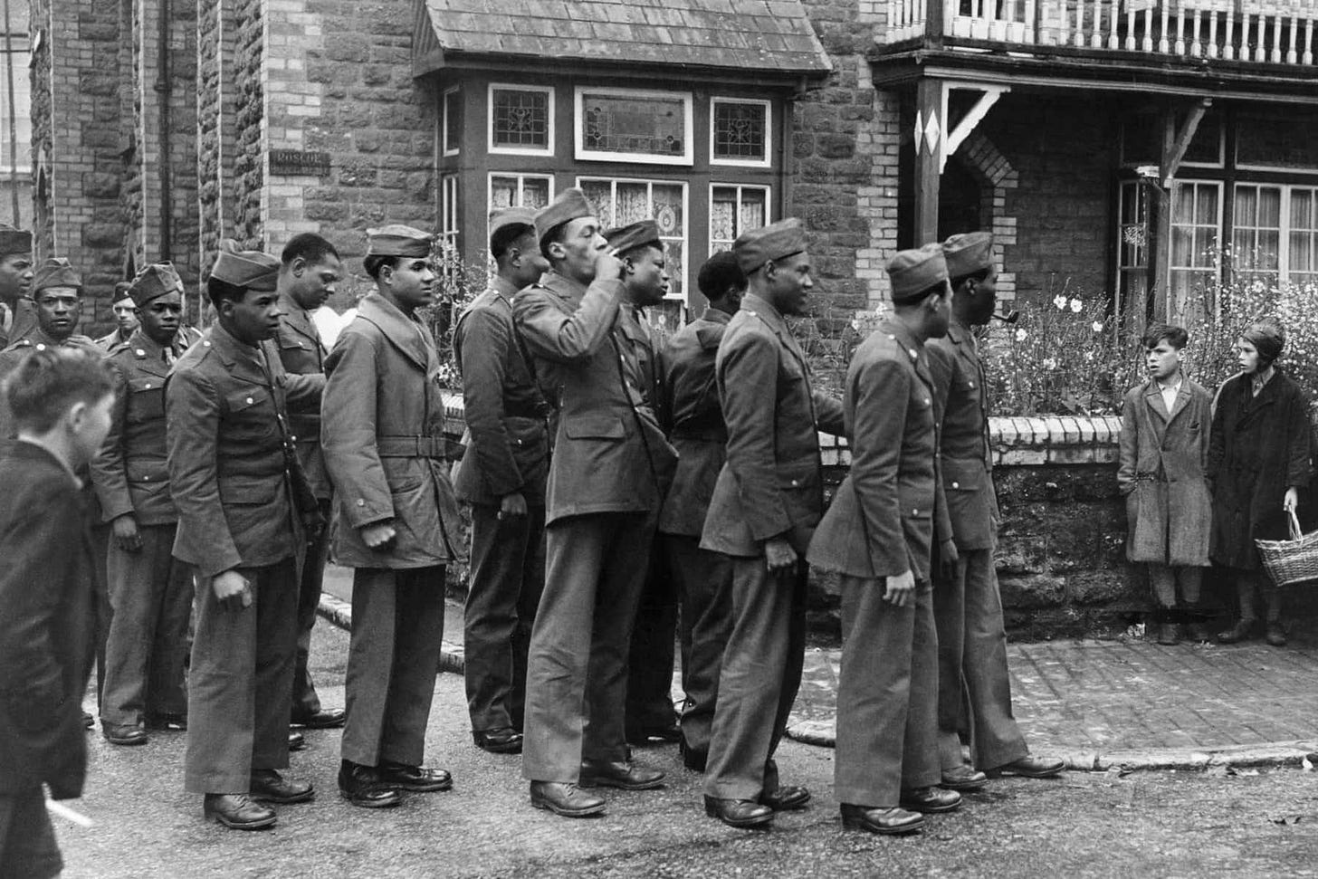 African American GIs arriving in Bamber Bridge, UK, June 1943, a significant moment during WWII.