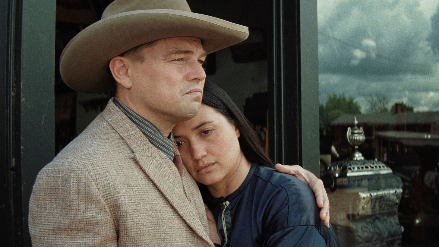 Killers of the Flower Moon | Still features Leonardo DiCaprio as Ernest Burkhart embracing Lily Gladstone as Mollie Kyle. Killers of the Flower Moon | Still features Leonardo DiCaprio as Ernest Burkhart embracing Lily Gladstone as Mollie Kyle.