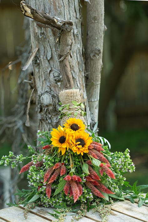 Brooms made with herbs and flowers. 