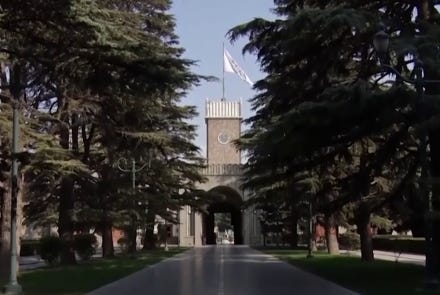 A clock tower in a park

Description automatically generated with low confidence