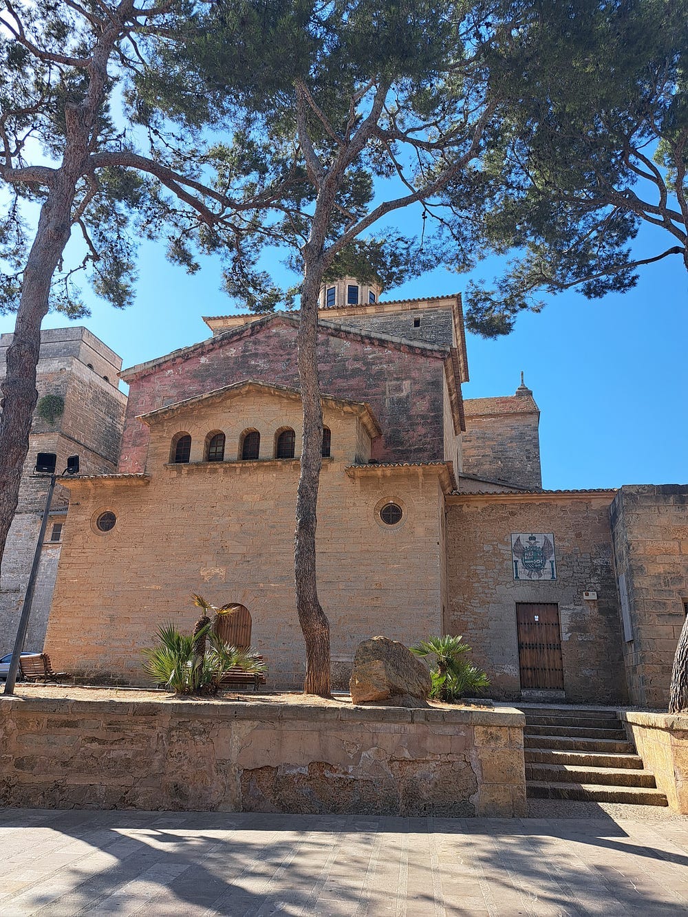 An ancient church towering into a clear blue sky.