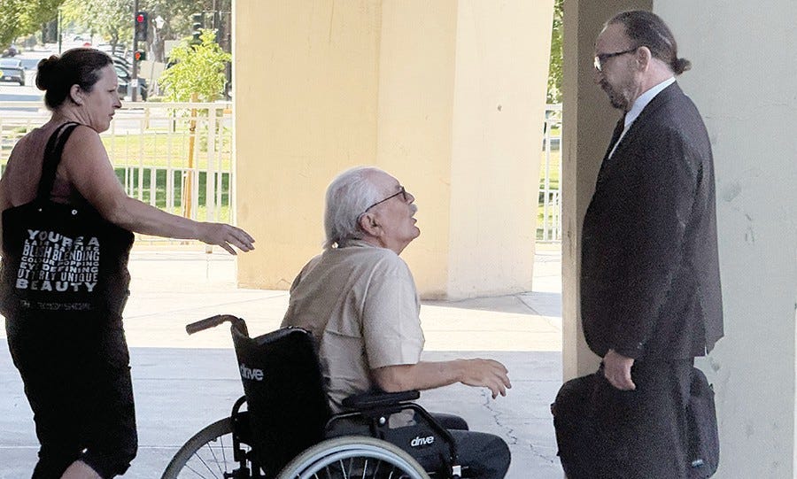 Ed Wackerman and his daughter get into a heated discussion with his defense attorney, Ric Squaglia, after a June 16 hearing at the Fresno County Superior Courthouse. Photo by Tom Lyden Ed Wackerman and his daughter get into a heated discussion with his defense attorney, Ric Squaglia, after a June 16 hearing at the Fresno County Superior Courthouse. Photo by Tom Lyden