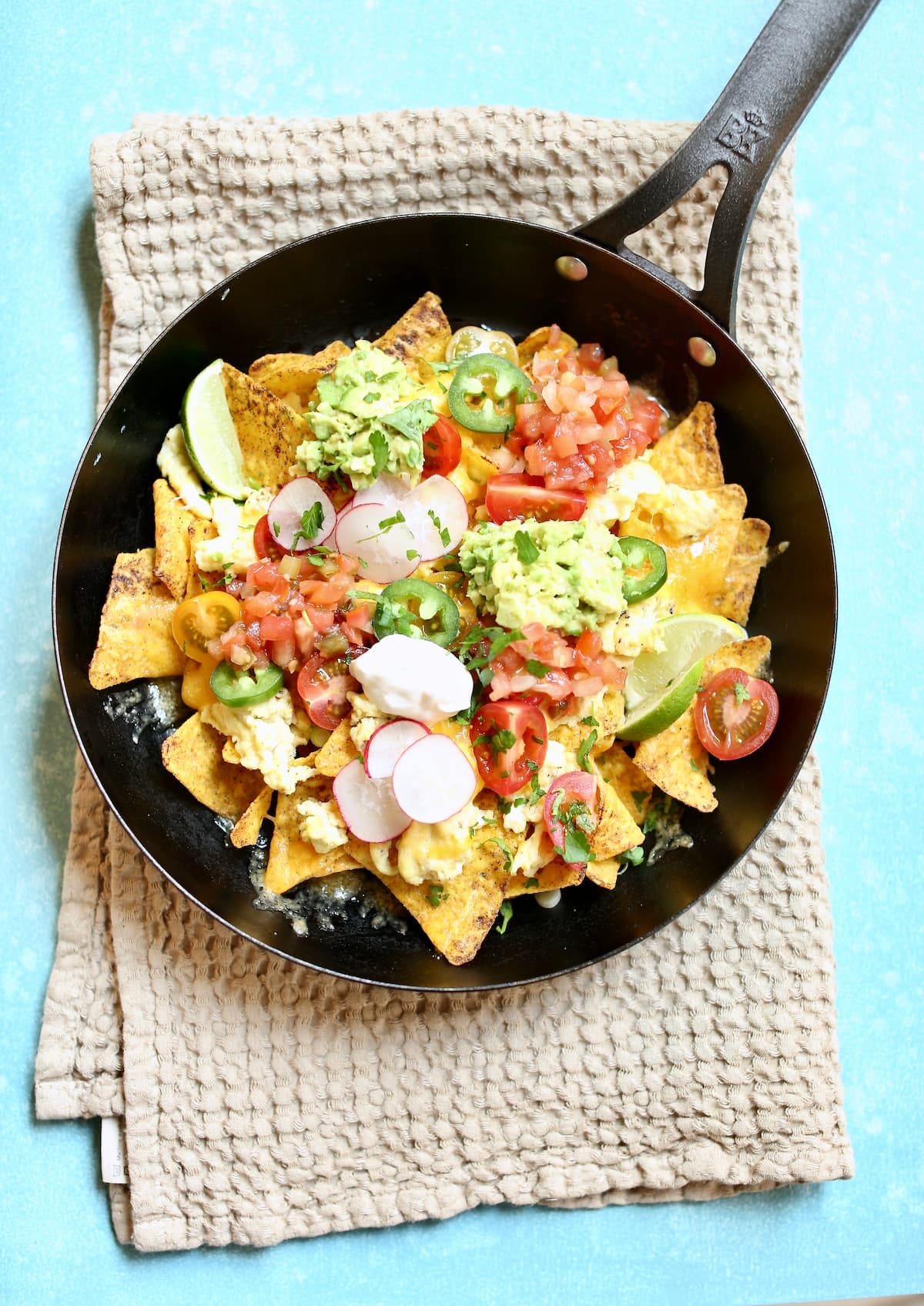 a skillet of breakfast nachos.