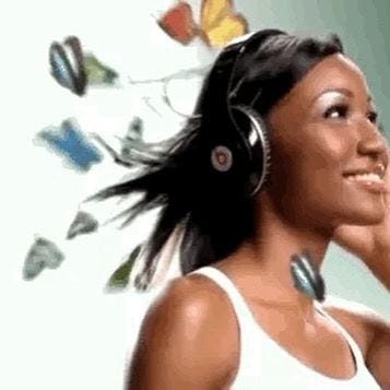 This may contain: a woman wearing headphones and listening to music with butterflies flying above her ear,
