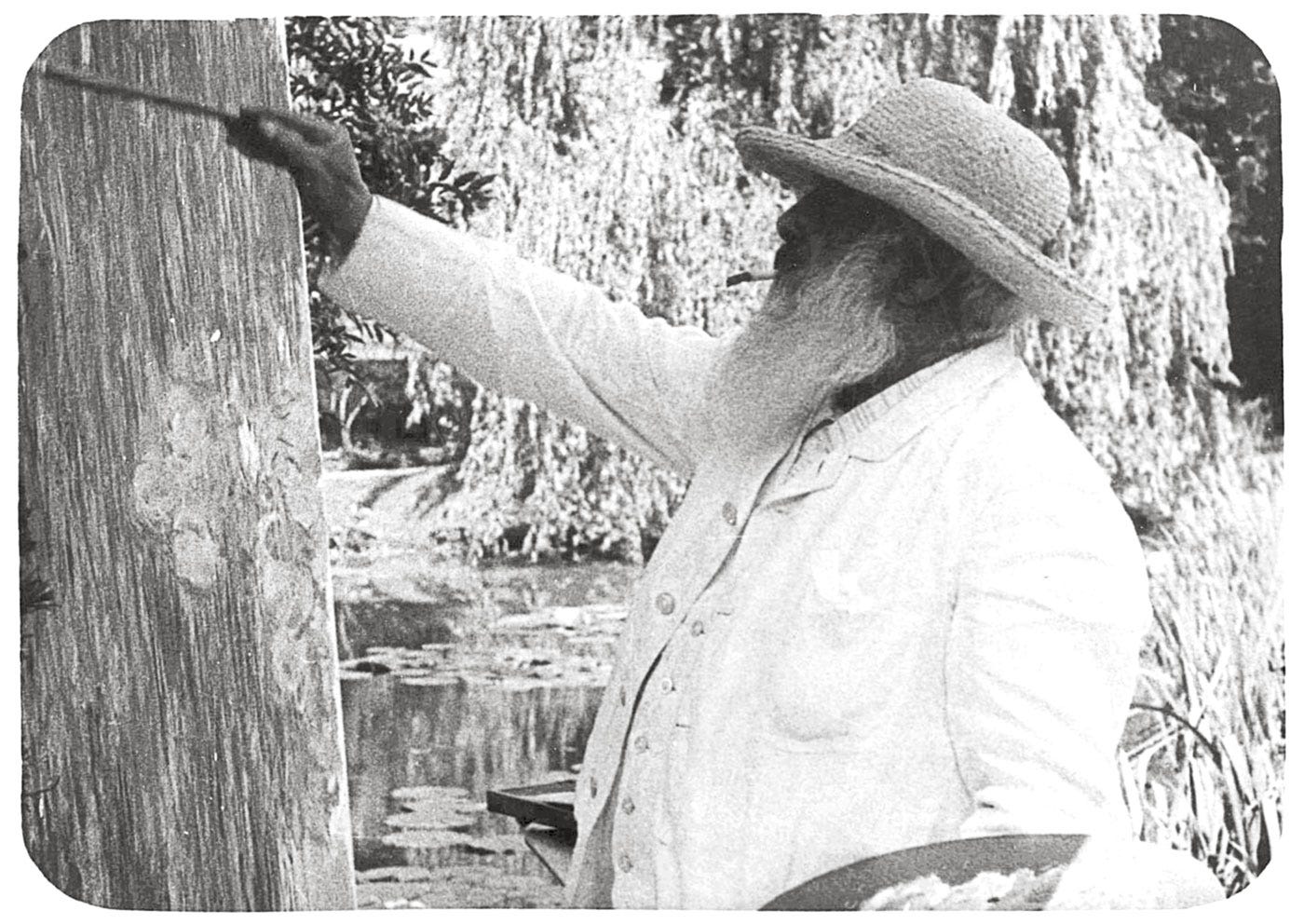 Still from a 1915 movie by Sacha Guitry, Monet painting water lilies in front of Giverny's water garden. 