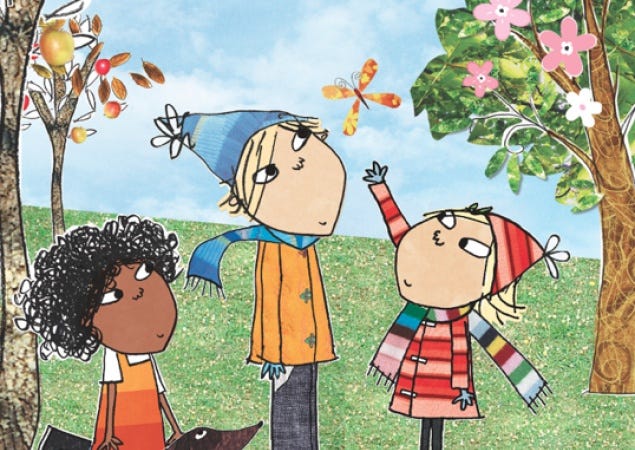 This may contain: three children are standing in the grass and one is pointing at another child's head