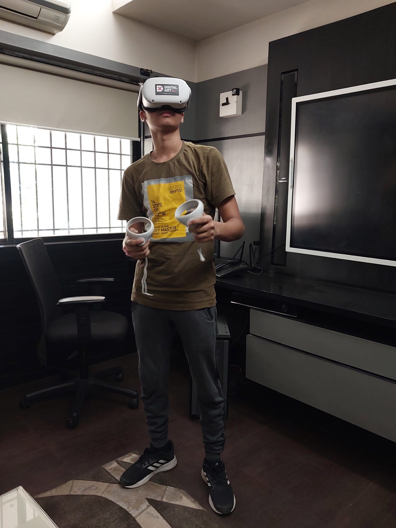 Photo of author in a room with a virtual reality headset on Photo of author in a room with a virtual reality headset on