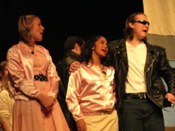 photos of Dr. Kiki in highschool acting as Marty in Grease.