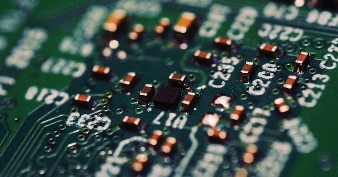 Close-up of a green circuit board with components.