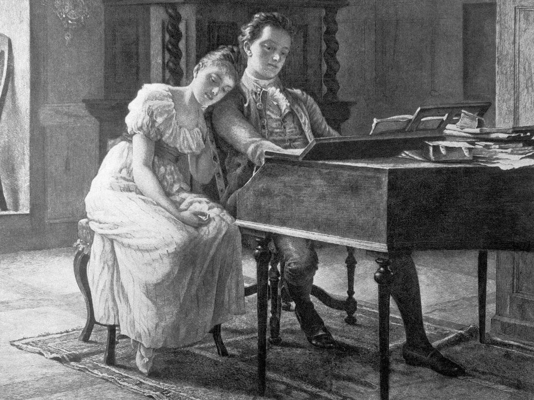 Black-and-white print depicting an early 19th-century drawing room where two figures, a young man and a young man, sit at a piano Black-and-white print depicting an early 19th-century drawing room where two figures, a young man and a young man, sit at a piano