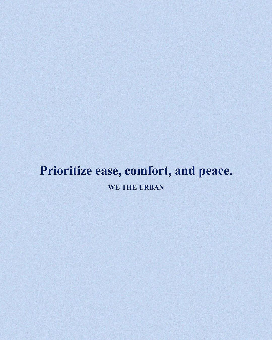 A blue quote on a blue background that reads, "Prioritize ease, comfort, and peace. - WE THE URBAN" A blue quote on a blue background that reads, "Prioritize ease, comfort, and peace. - WE THE URBAN"
