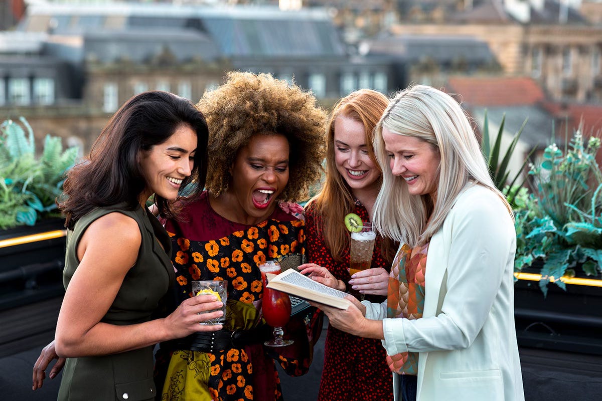 Women celebrating book launch