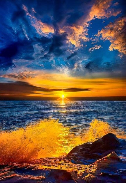 Sunset scene with rock in the foreground