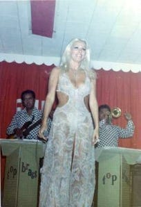 A person in a white dress

Description automatically generated