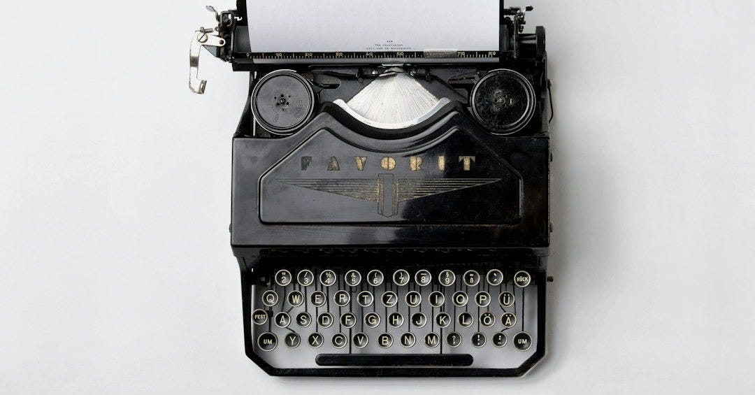 black Fayorit typewriter with printer paper black Fayorit typewriter with printer paper