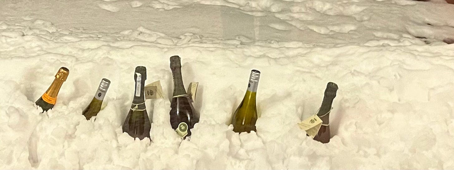 champagne and sparkling wine in the snow new years eve