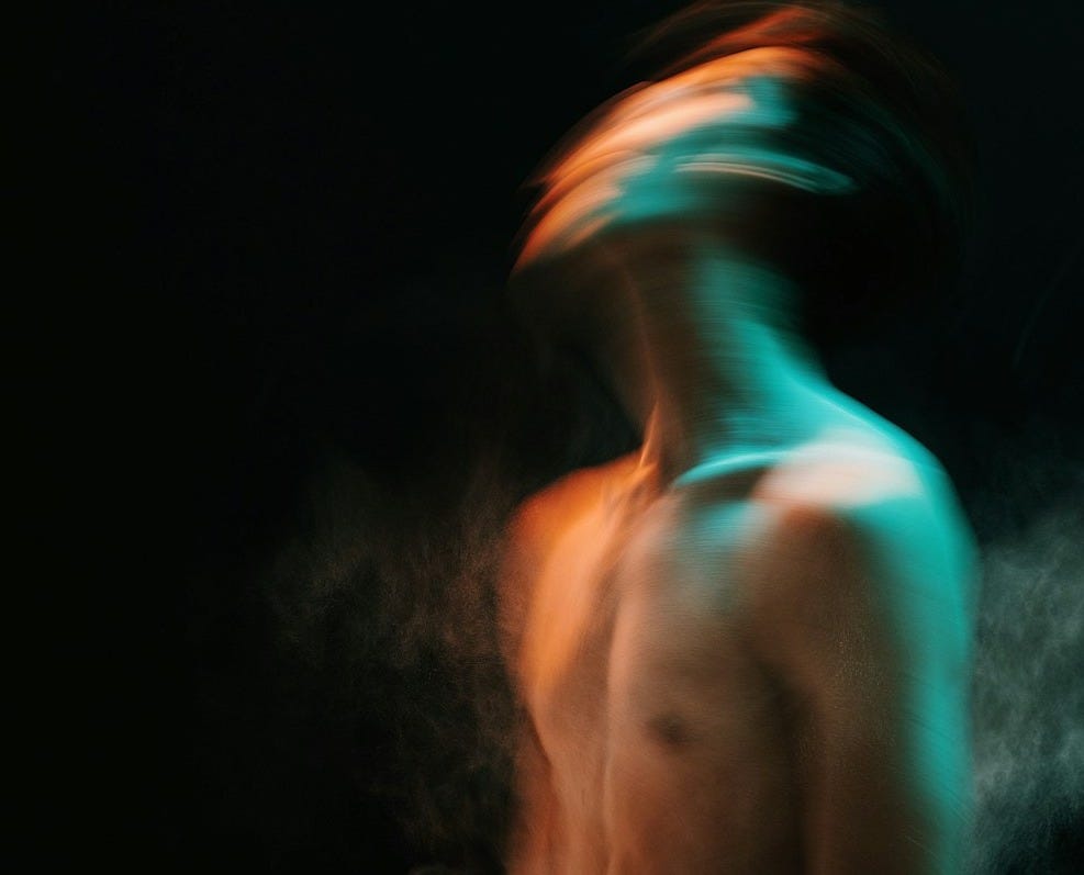 topless woman with blue and green smoke topless woman with blue and green smoke