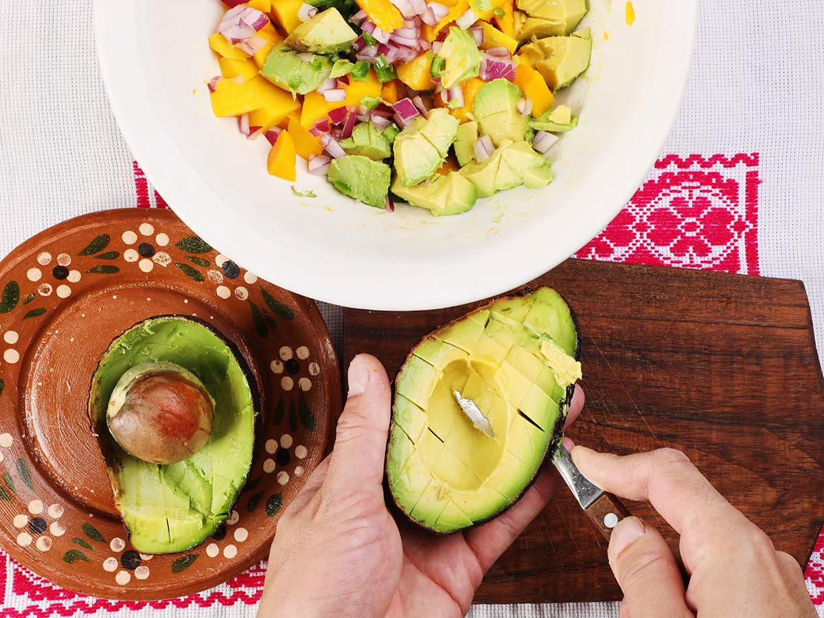 scooping avocados with spoon
