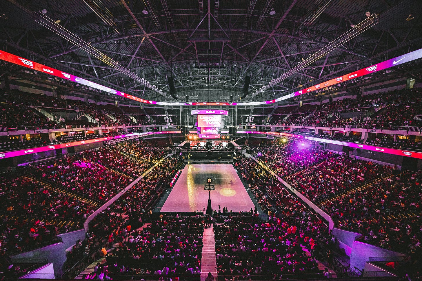 A Basketball Arena is completely full, waiting for the game to start. The basketball court is empty. A Basketball Arena is completely full, waiting for the game to start. The basketball court is empty.