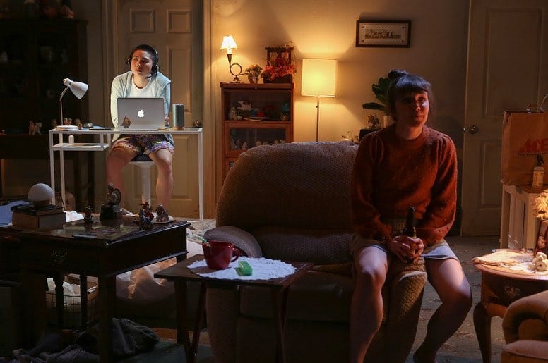 May be an image of 2 people, people sitting and indoor