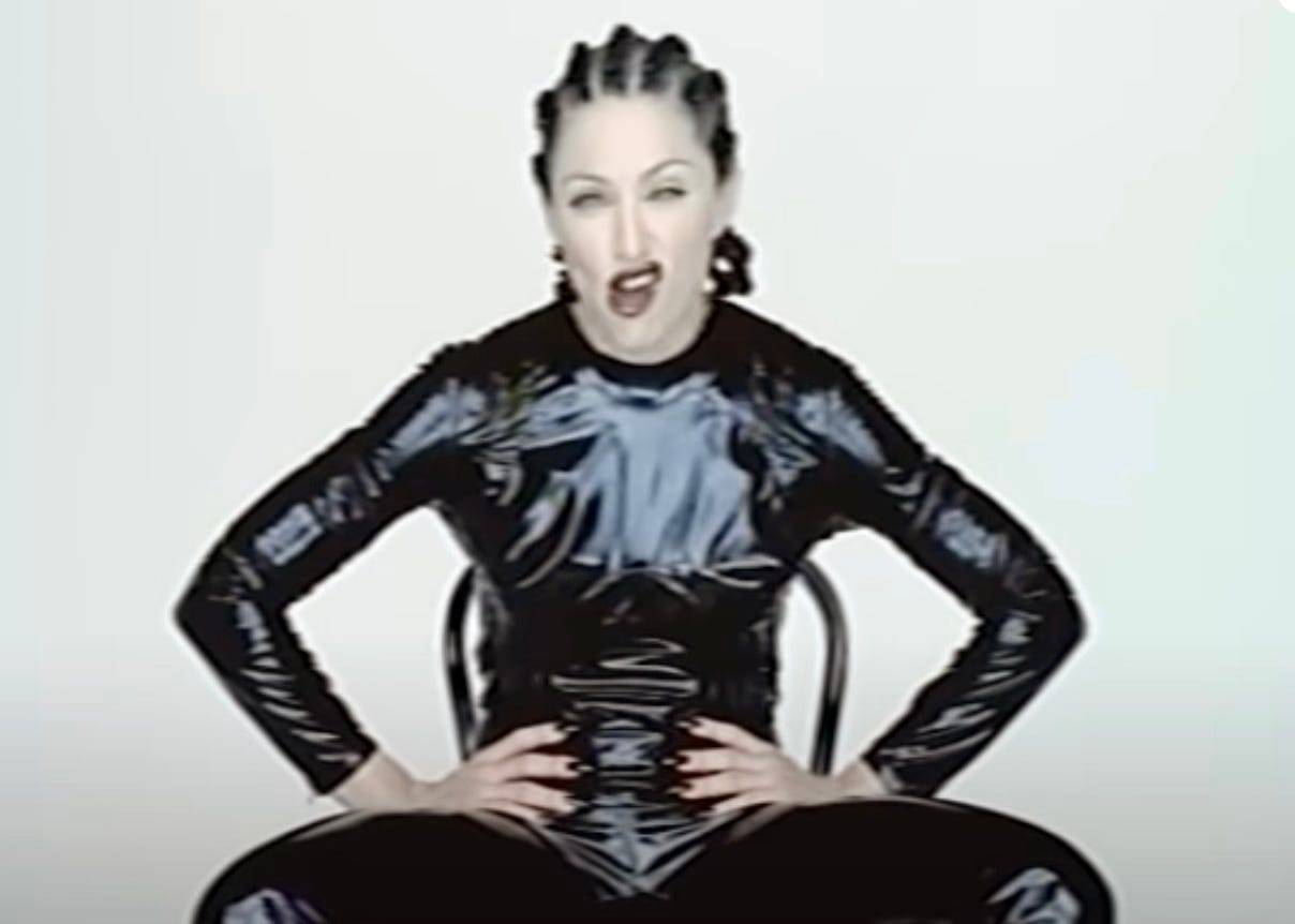 Madonna in the Human Nature gurning into the camera