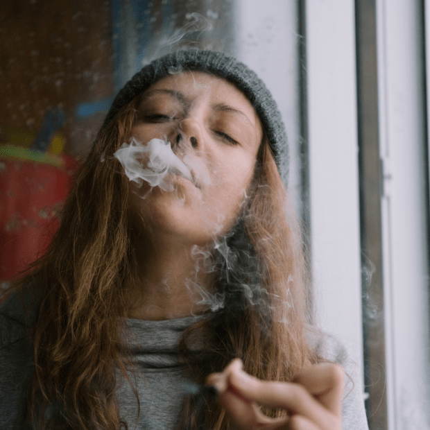 addiction shown by woman smoking marijuana
