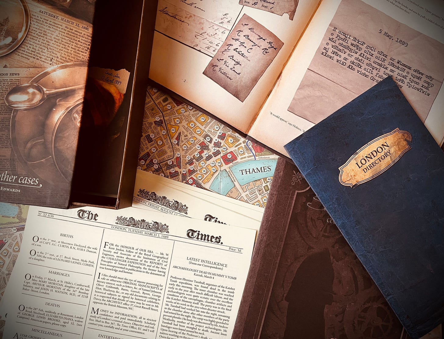 Photo showing a few editions of the London Times, as well as letters and notes "found at the scene"