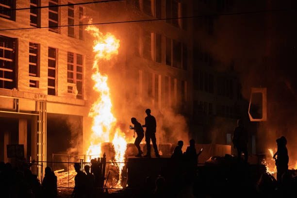 Minneapolis, MN May 27: Rioters set fire to a multi-story affordable housing complex under construction near the Third Precinct. Protester and police...