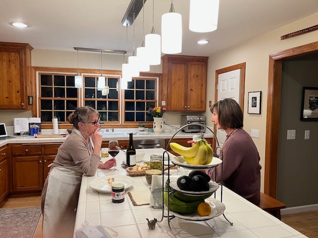 Two photos of Paulette and I over dinner.