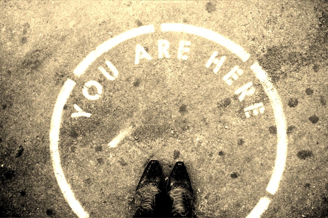 person wearing black leather shoes person wearing black leather shoes
