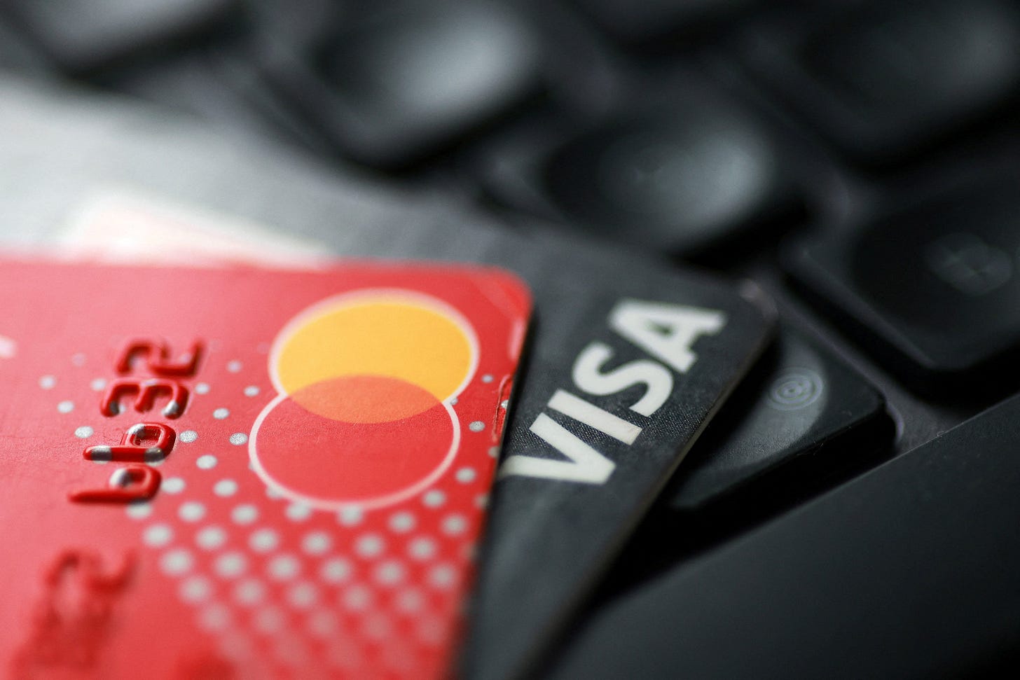 Illustration shows Visa and Mastercard cards