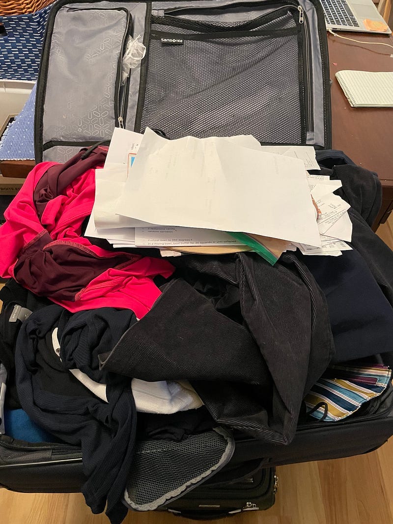 An unpacked, messy suitcase