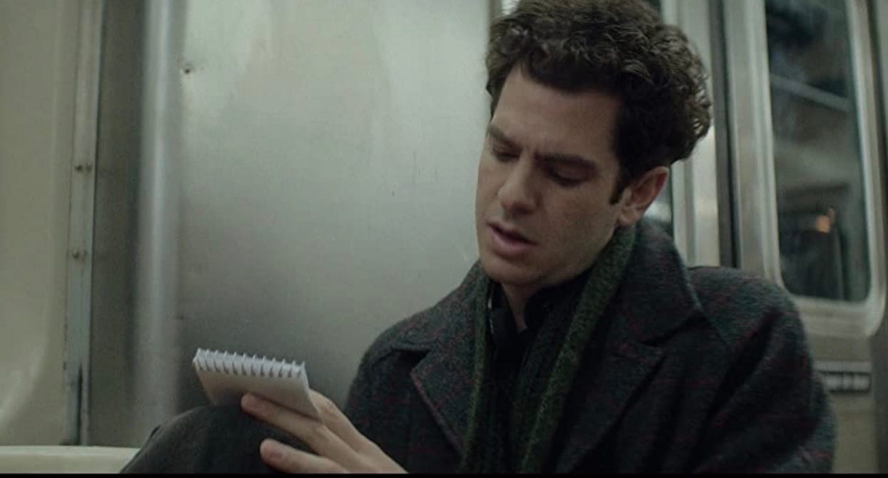 Andrew Garfield as Jonathan Larson, always taking notes