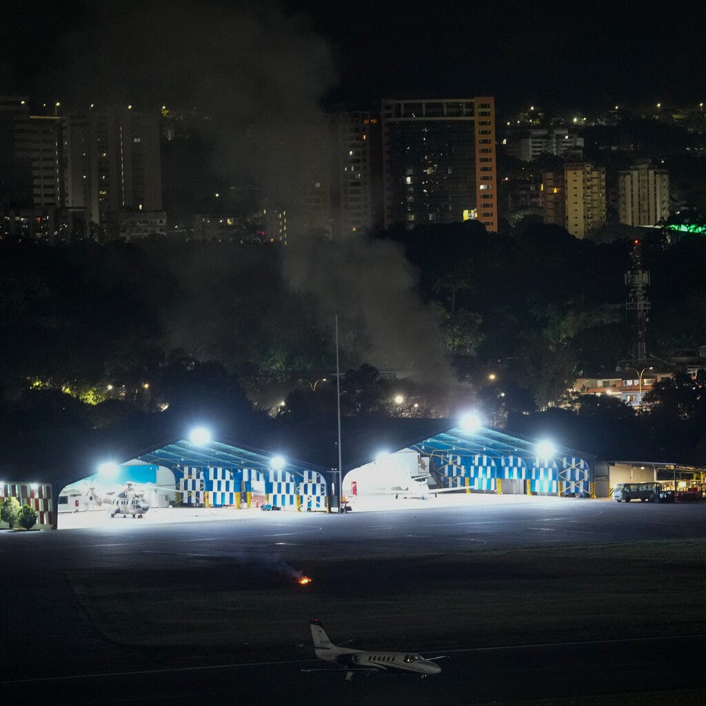 Smoke rising at La Carlota airport in Caracas, Venezuela. 
