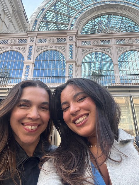two women in front of the O2 arena; a woman in front of Keats House in Hampstead, two women in front of the Royal Opera House in London; the inside of the Royal Opera House in London; tower bridge at night; a picnic in the park