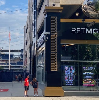 A person and person standing outside of a building

AI-generated content may be incorrect.