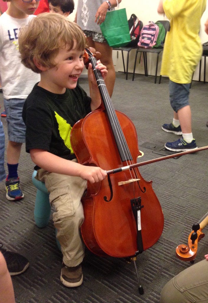 Milo tries the cello Milo tries the cello
