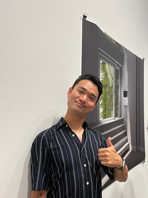 images of artists standing next to their artworks
