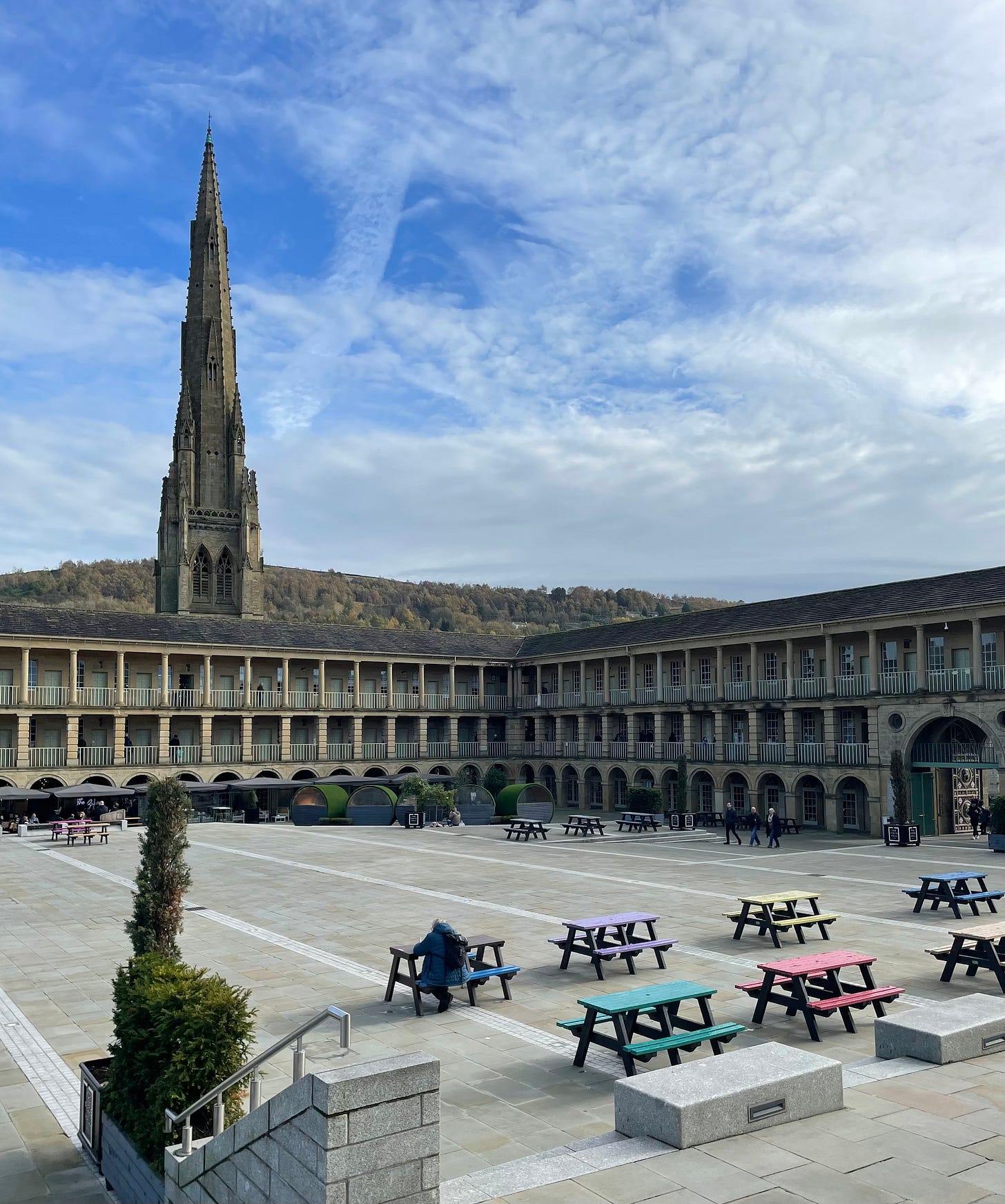 The centre square of the Halifax Piece Hall, a building which looks like a cross between an Oxford College and a factory.