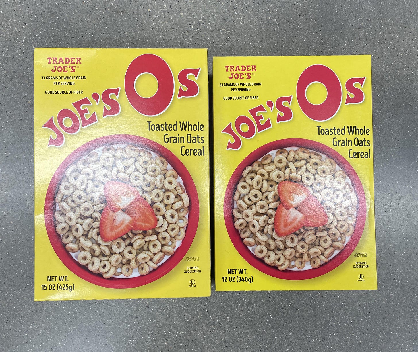 Photograph of two boxes of Trader Joe's Joe's Os. The one on the left is 15 oz. The one on the right is about half an inch shorter and only 12 oz.