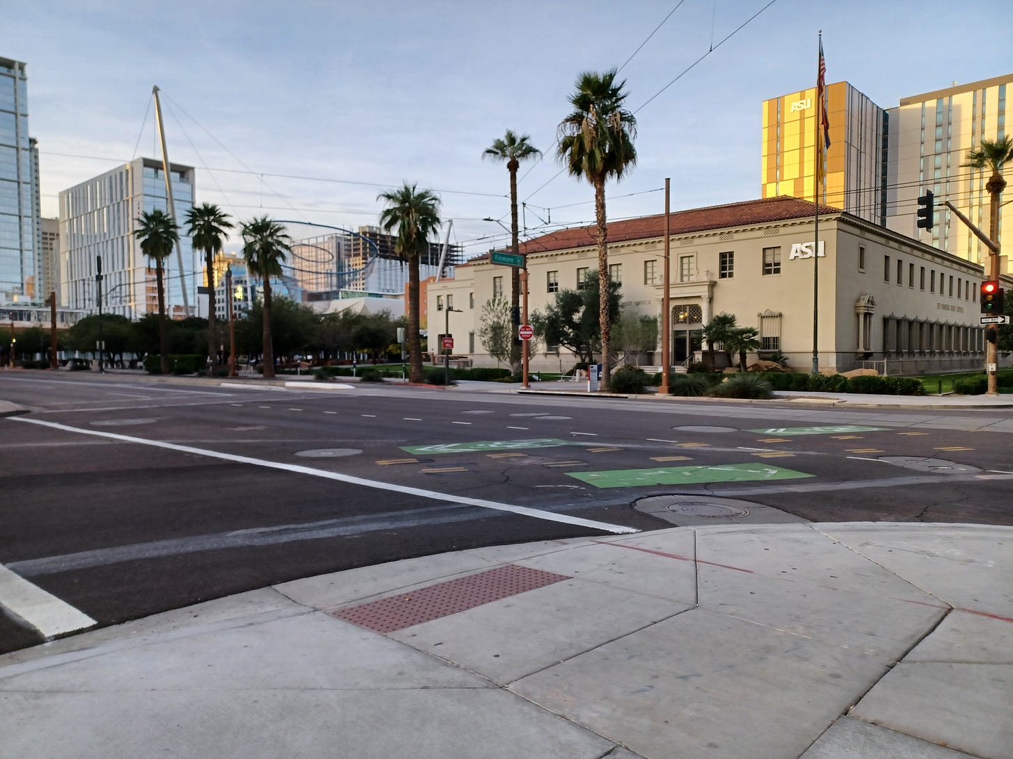 Telephone lines cross above buildings, including an Arizona State University center, Phoenix, Arizona, December 30, 2025. 