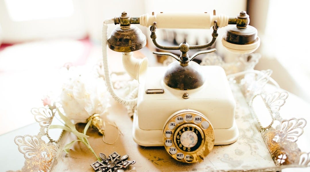 white and black rotary phone