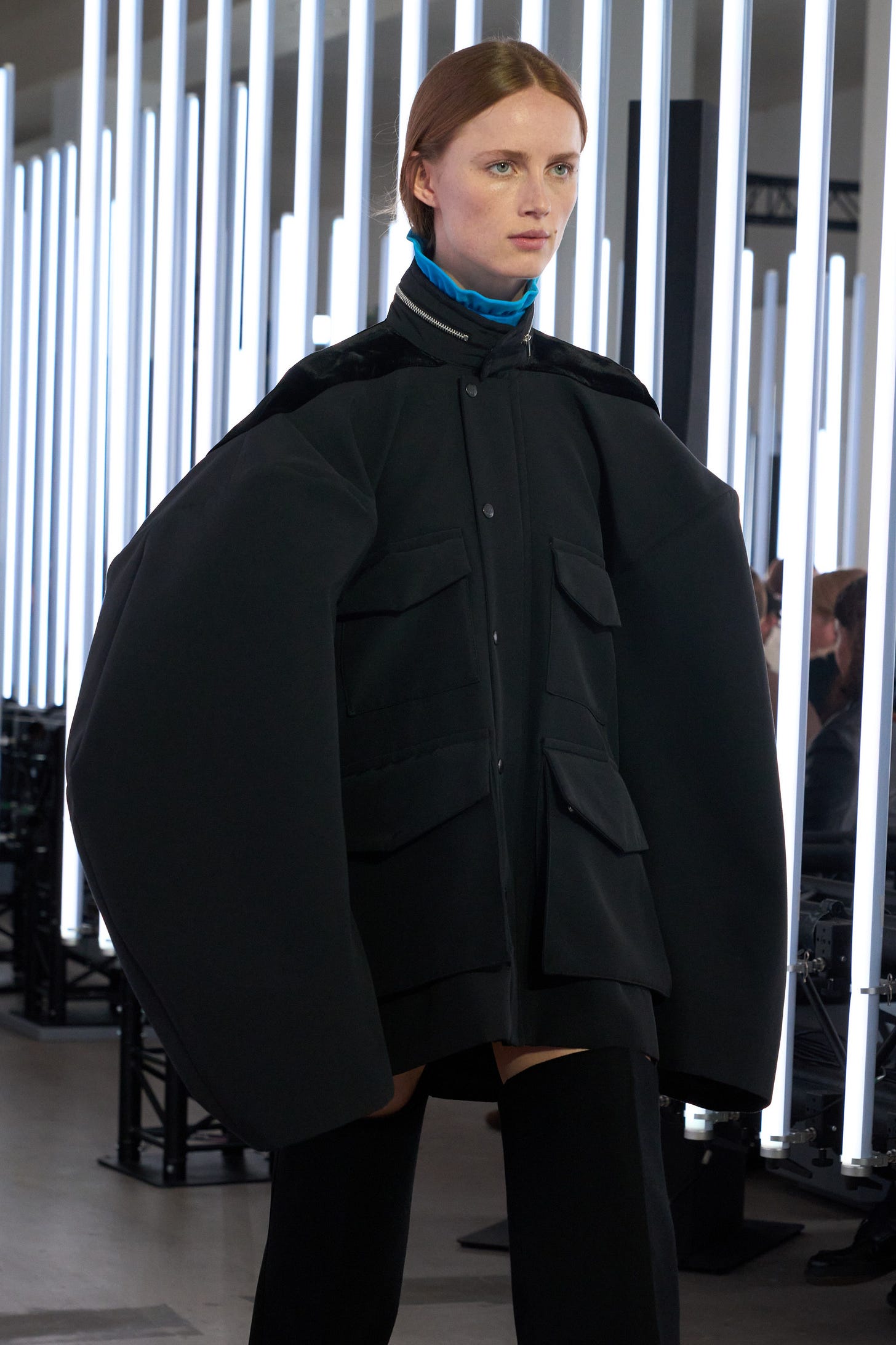 Image may contain Clothing Coat Adult Person Long Sleeve Sleeve Jacket Overcoat Fashion and Cape