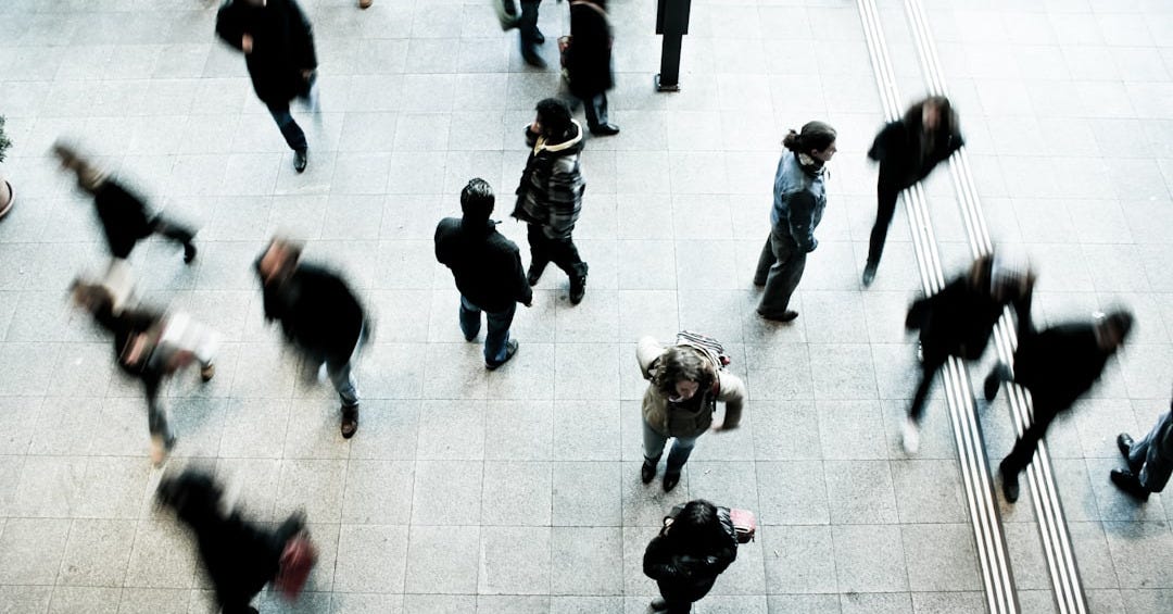 people walking on grey concrete floor during daytime