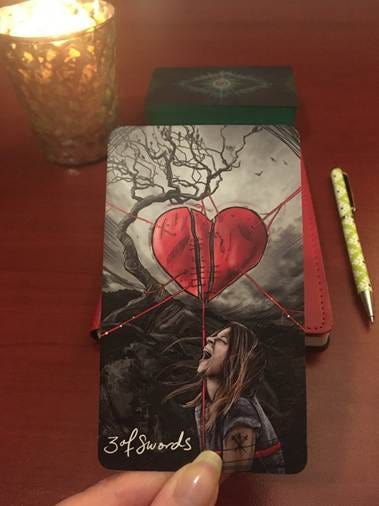 A heart shaped object with a red string attached to it

AI-generated content may be incorrect.