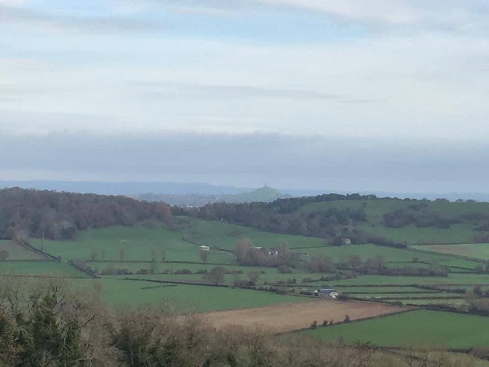 View from large hill of green countryside View from large hill of green countryside