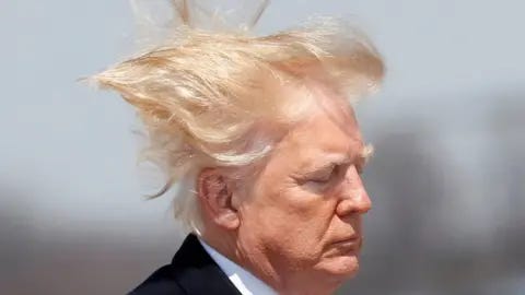 Reuters US President Donald Trump boards Air Force One on a windy day in Maryland in 2018
