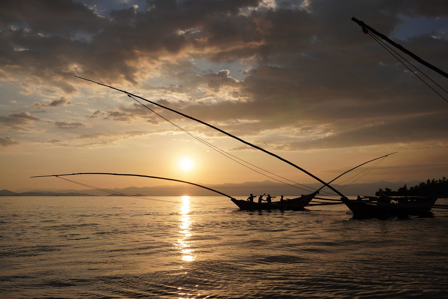 The singing fishermen on Lake Kivu, photographed as the sun sets