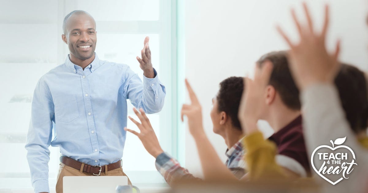 teacher successfully managing a classroom of high school aged students
