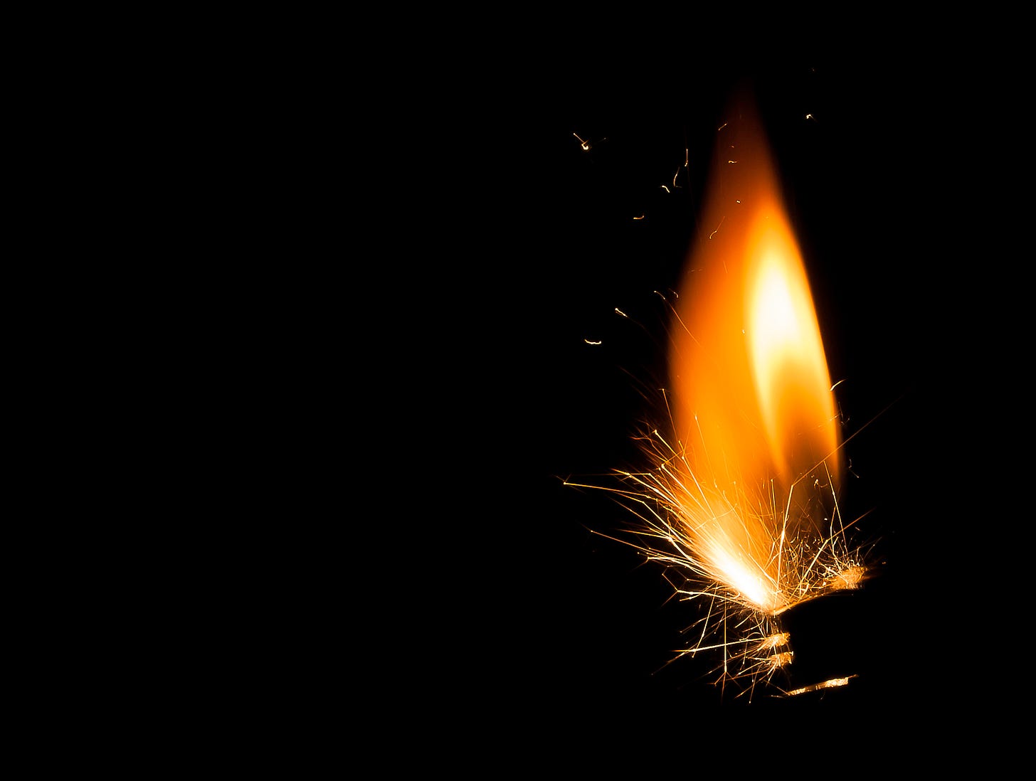 Flame of a cigarette lighter, sparking
